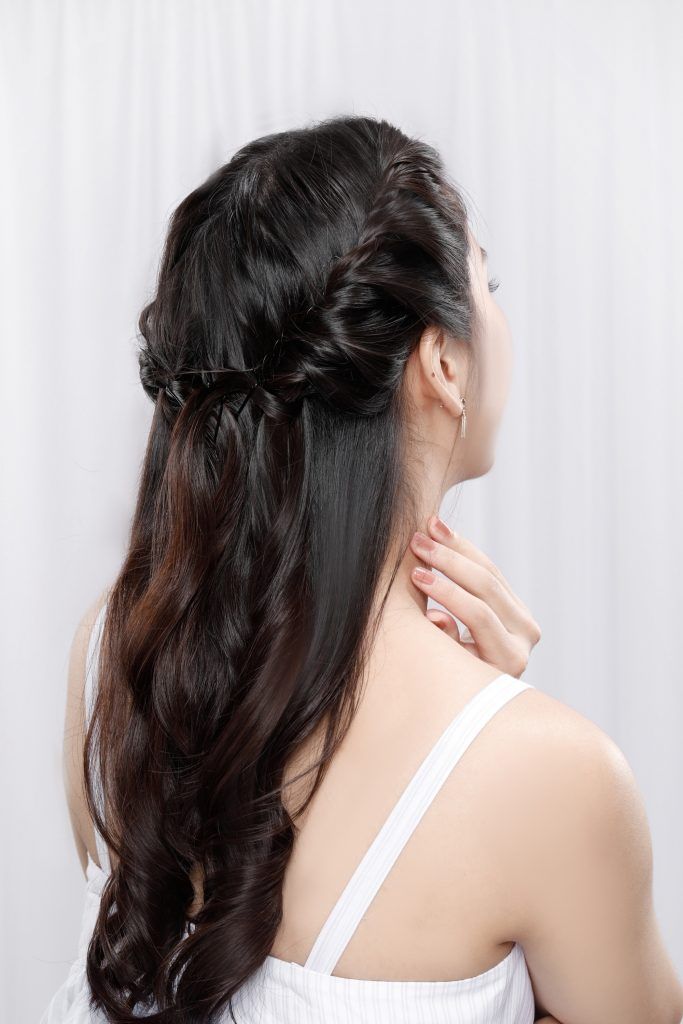 Back shot of an Asian woman with long hair