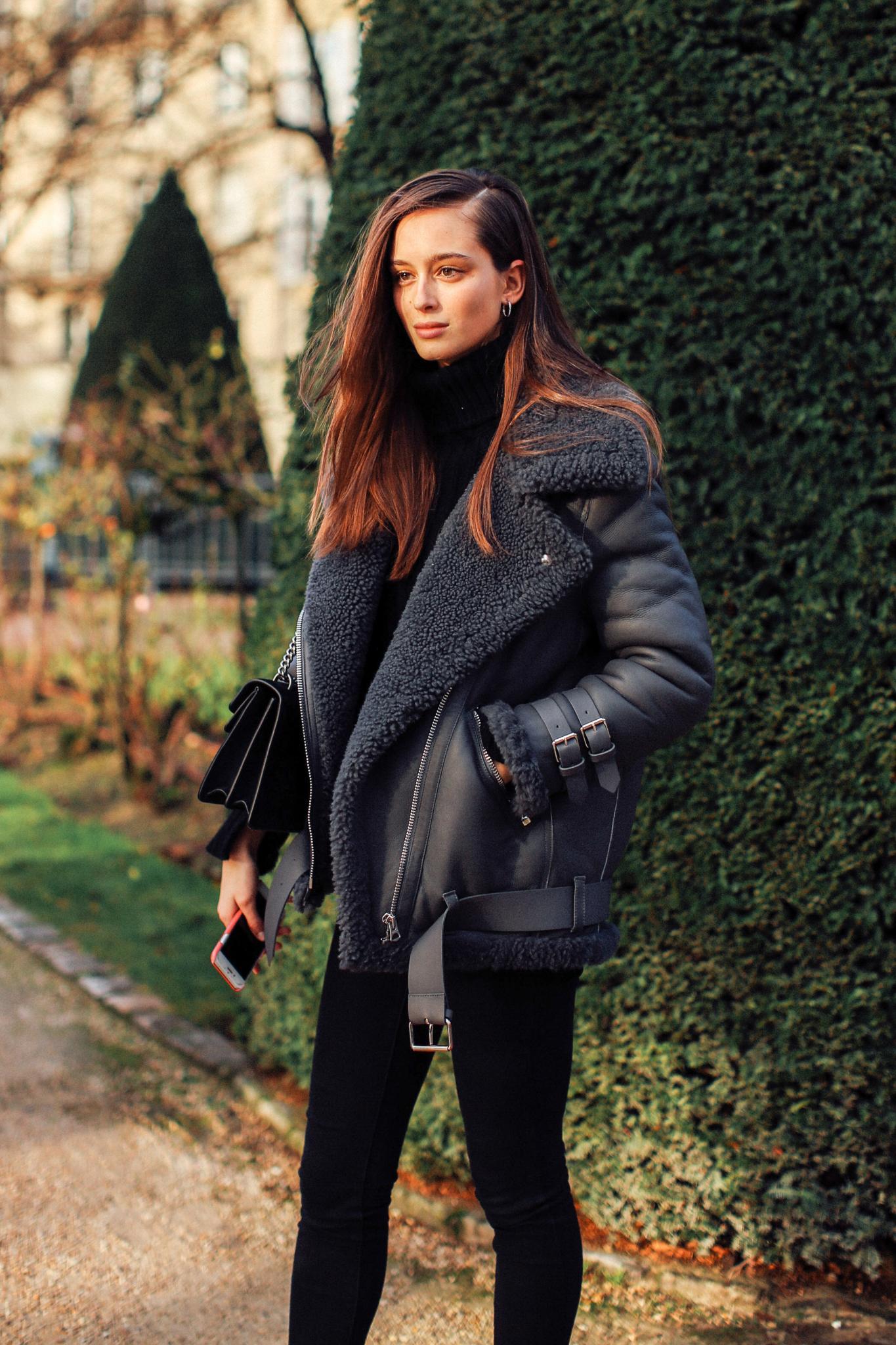 Mother's Day hair: Woman with long brown hair wearing a black coat outdoors